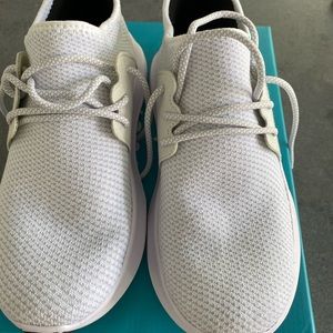 Women’s white Vessi runners